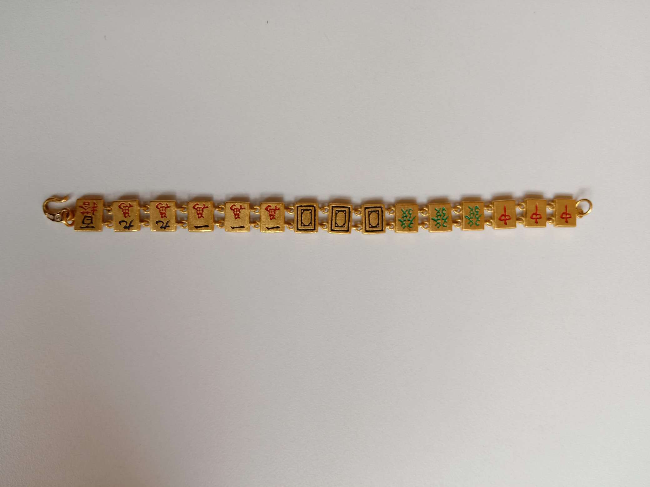 gold bracelet with mahjong design