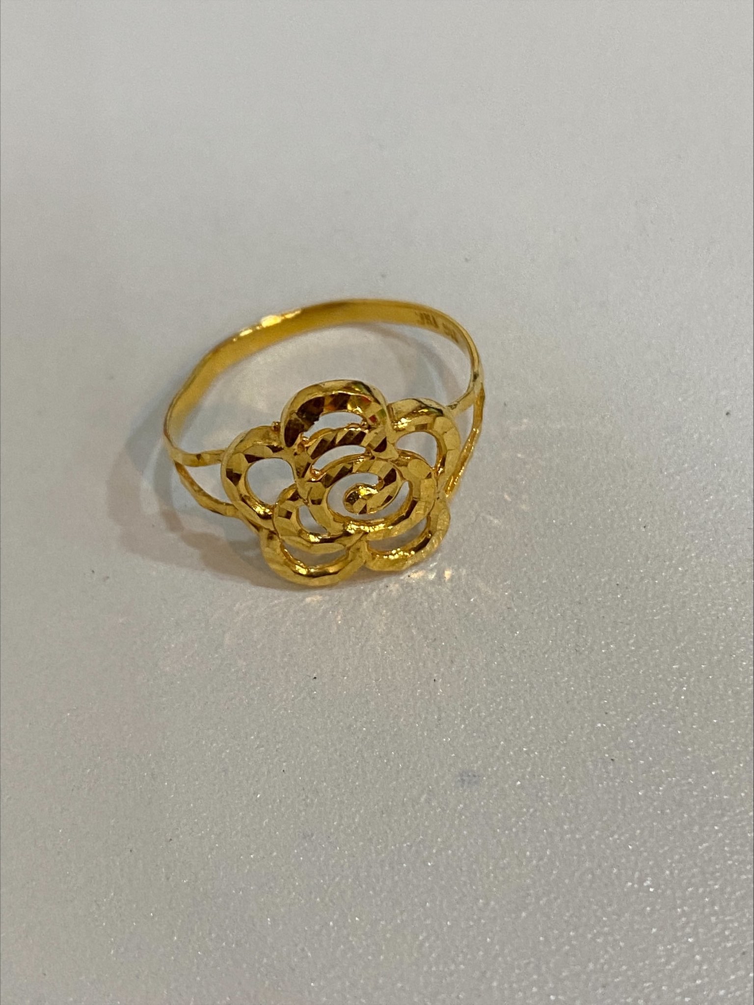 gold ring with flower design