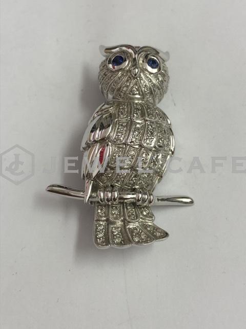 K18 sapphire and brooch with melee diamond